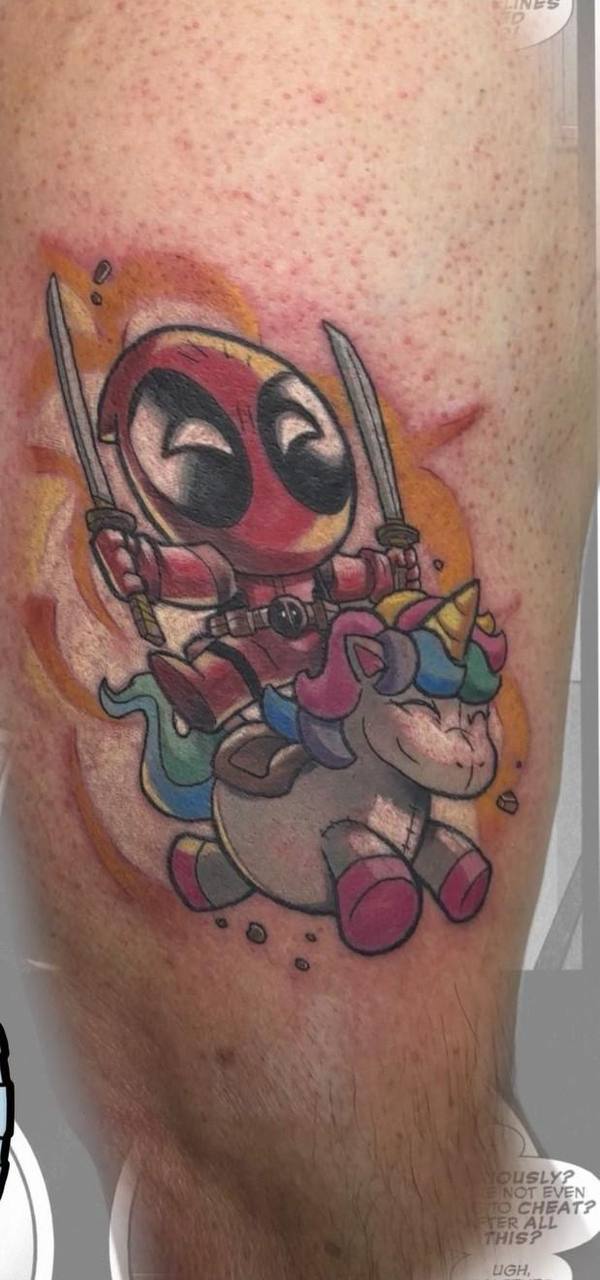 Chibi Deadpool riding unicorn tattoo, colorful